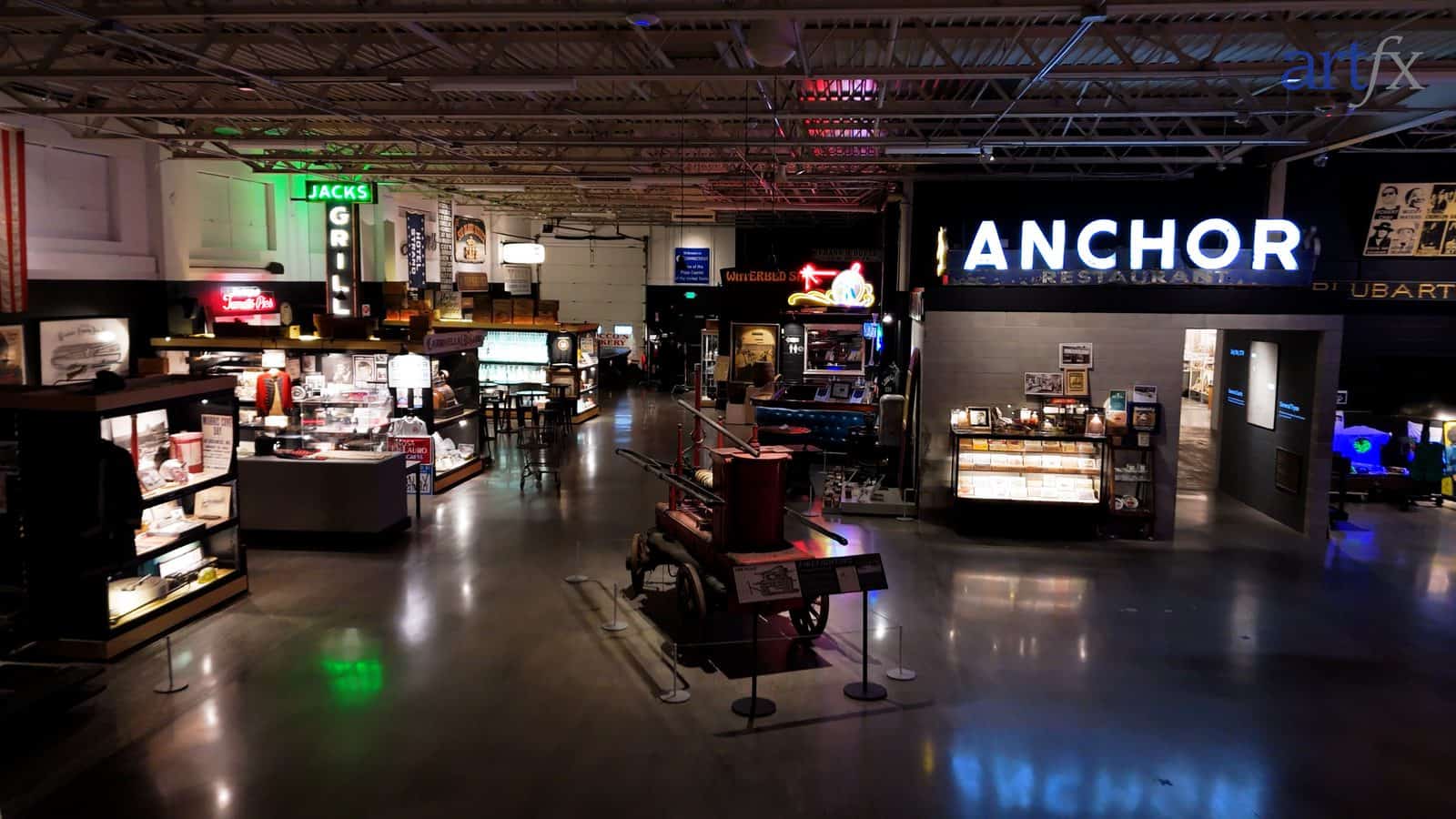 The main hall at the Lost in New Haven museum, lined with restored neon and channel-letter signs including the Anchor Restaurant and Jack's Grill, fabricated by ARTfx