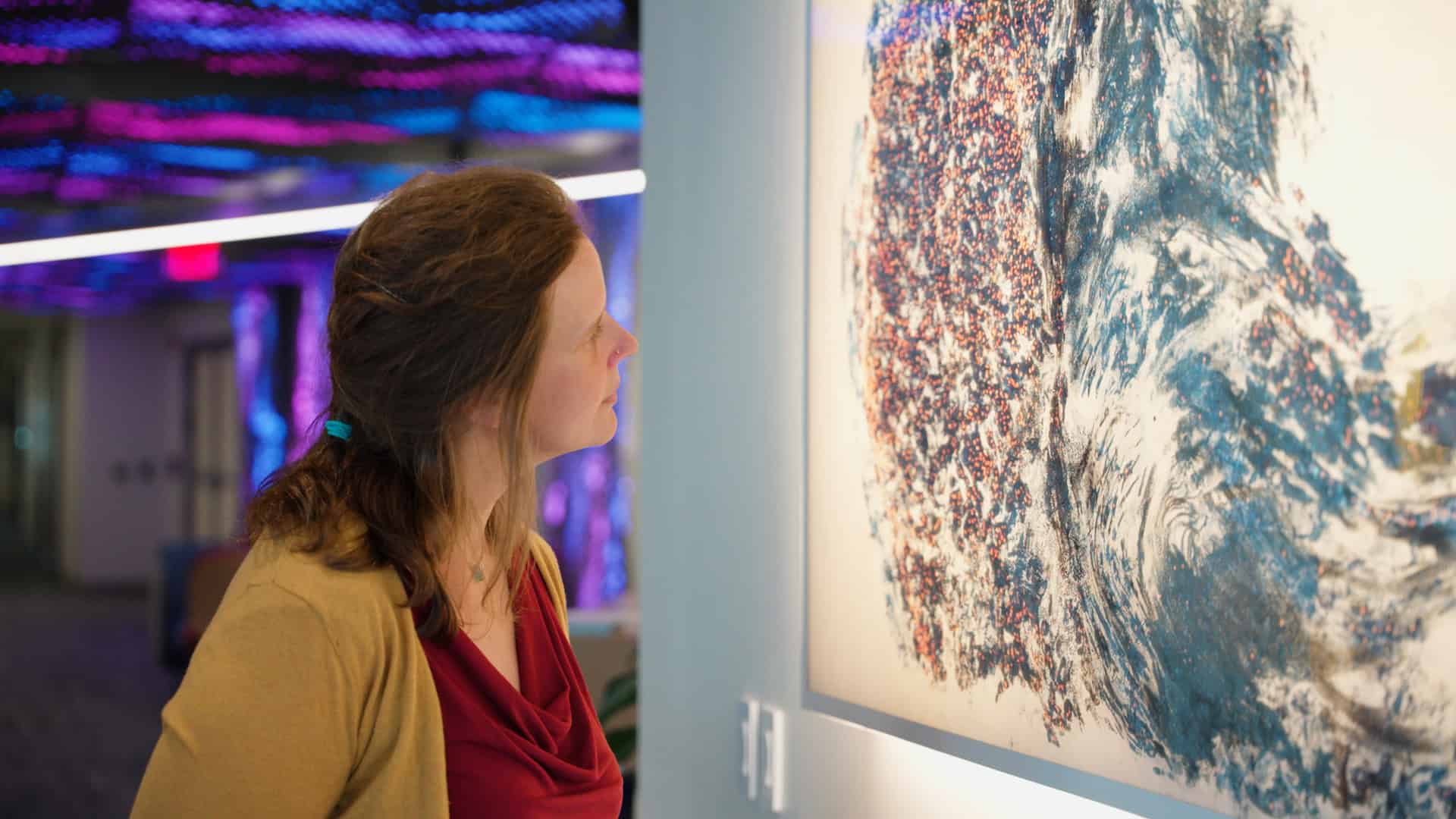 A Quantum Leap in Lighting: Backlighting a Yale Artist's Masterpiece 4 A visitor studying the illuminated detail of Saliency, La Memoria Cangiante up close
