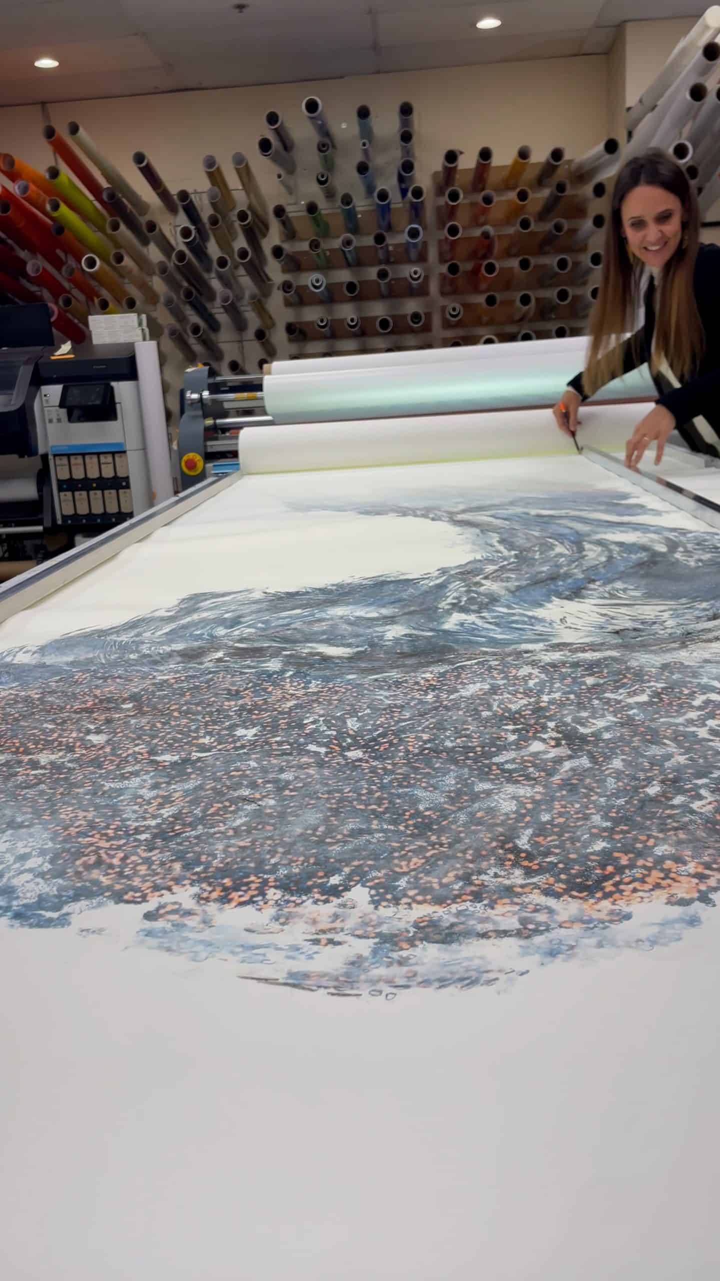 A Quantum Leap in Lighting: Backlighting a Yale Artist's Masterpiece 1 Artist Serena Scapagnini working on her large-scale painting on the layout table inside the ARTfx shop