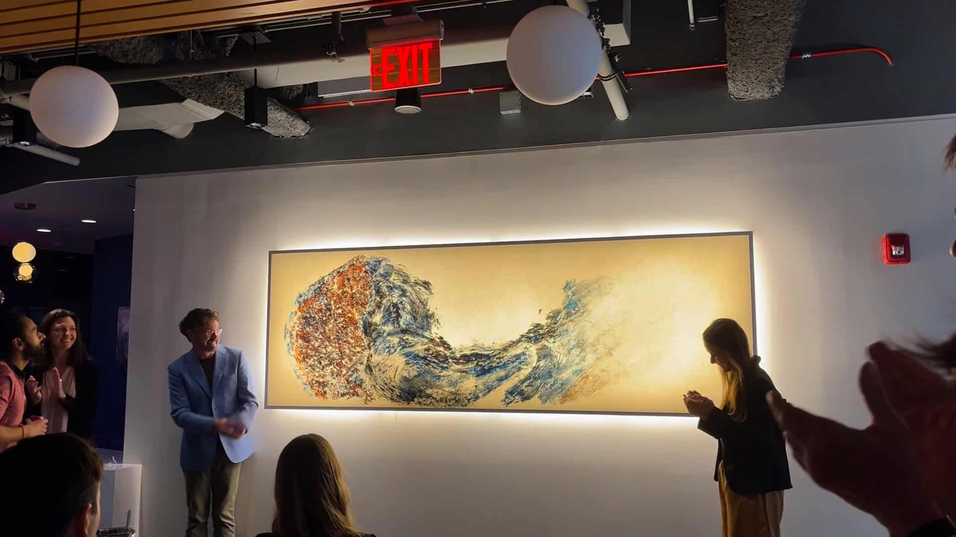 A Quantum Leap in Lighting: Backlighting a Yale Artist's Masterpiece 3 Guests applauding at the unveiling of the backlit installation in the Wu Tsai Institute atrium